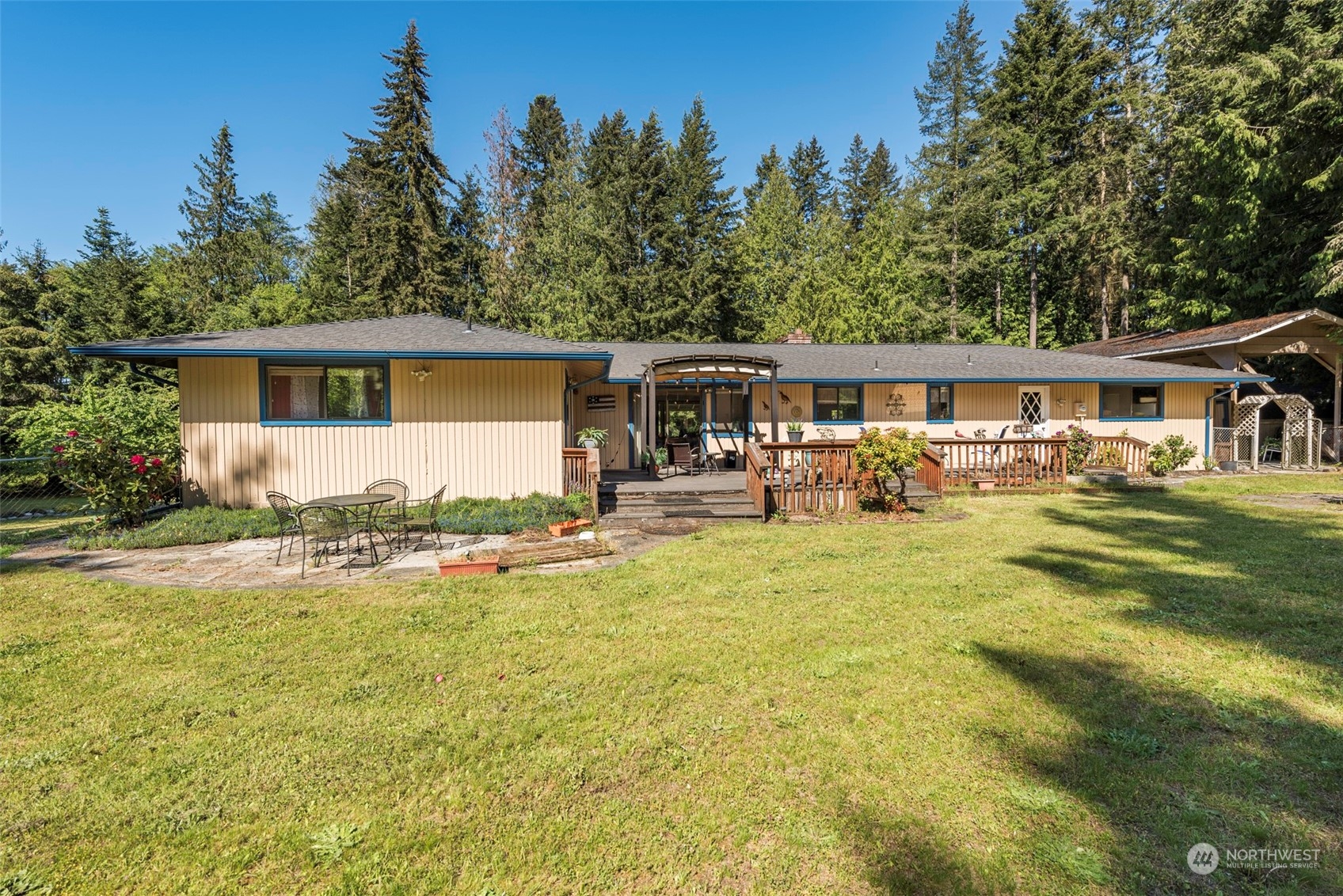 306 Webb Road Sequim, WA 98382 - Photo 27 of 40 a view of a house with swimming pool and sitting area