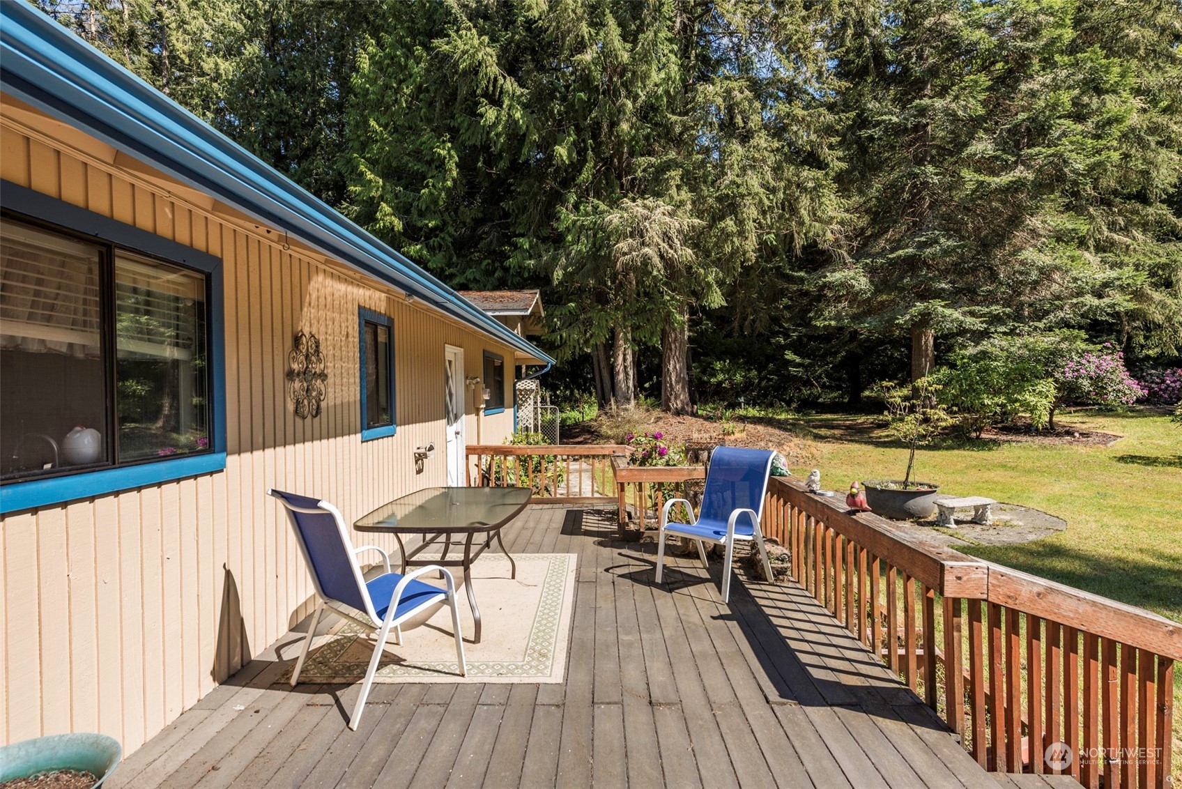 306 Webb Road Sequim, WA 98382 - Photo 28 of 40 a view of deck with furniture and trees
