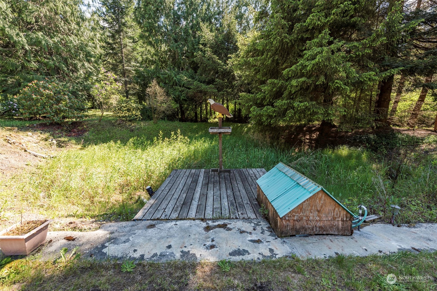 306 Webb Road Sequim, WA 98382 - Photo 32 of 40 a view of a wooden floor and lake in the background