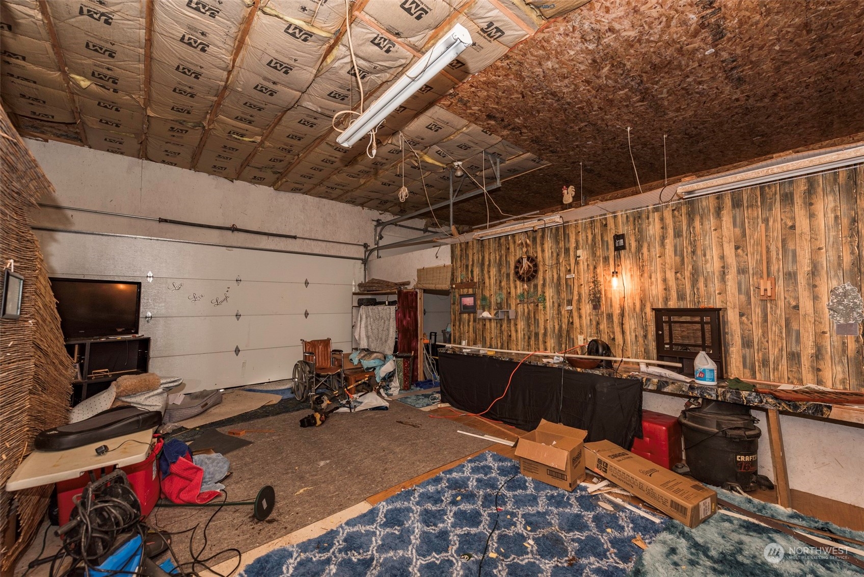 306 Webb Road Sequim, WA 98382 - Photo 39 of 40 a room with gym equipment and flat screen tv