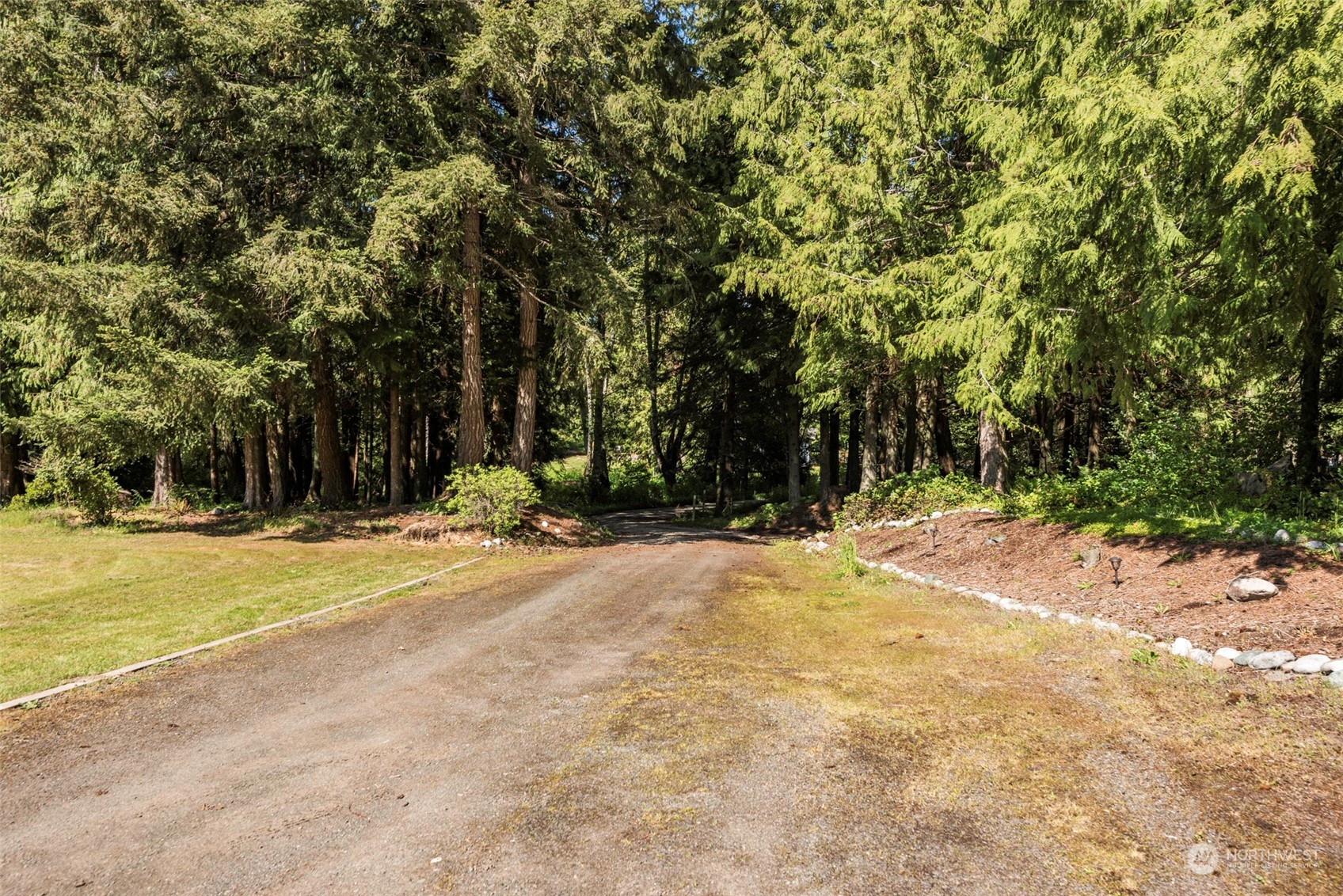 306 Webb Road Sequim, WA 98382 - Photo 40 of 40 a view of a house with a yard and large trees