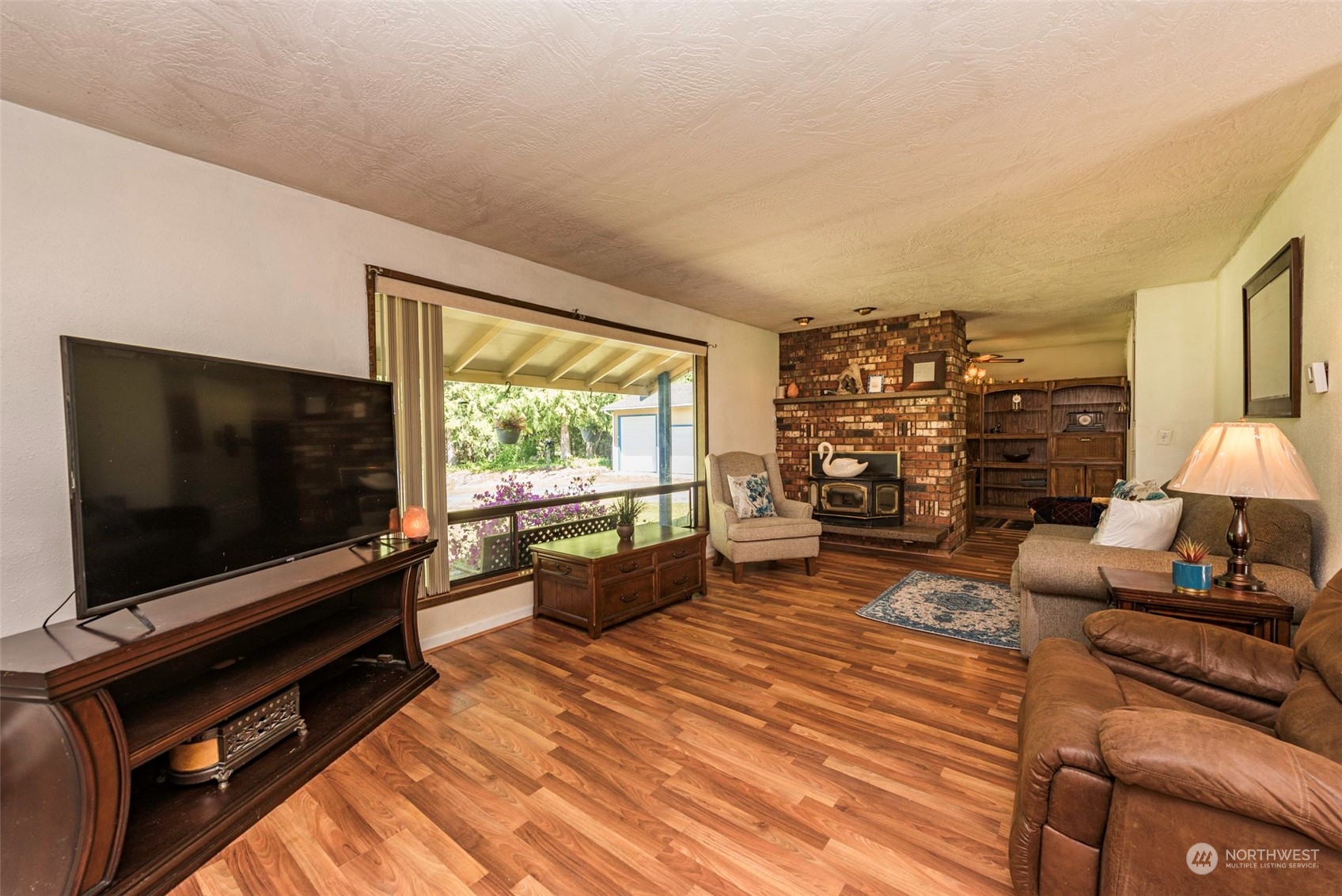 306 Webb Road Sequim, WA 98382 - Photo 6 of 40 a living room with furniture and a flat screen tv