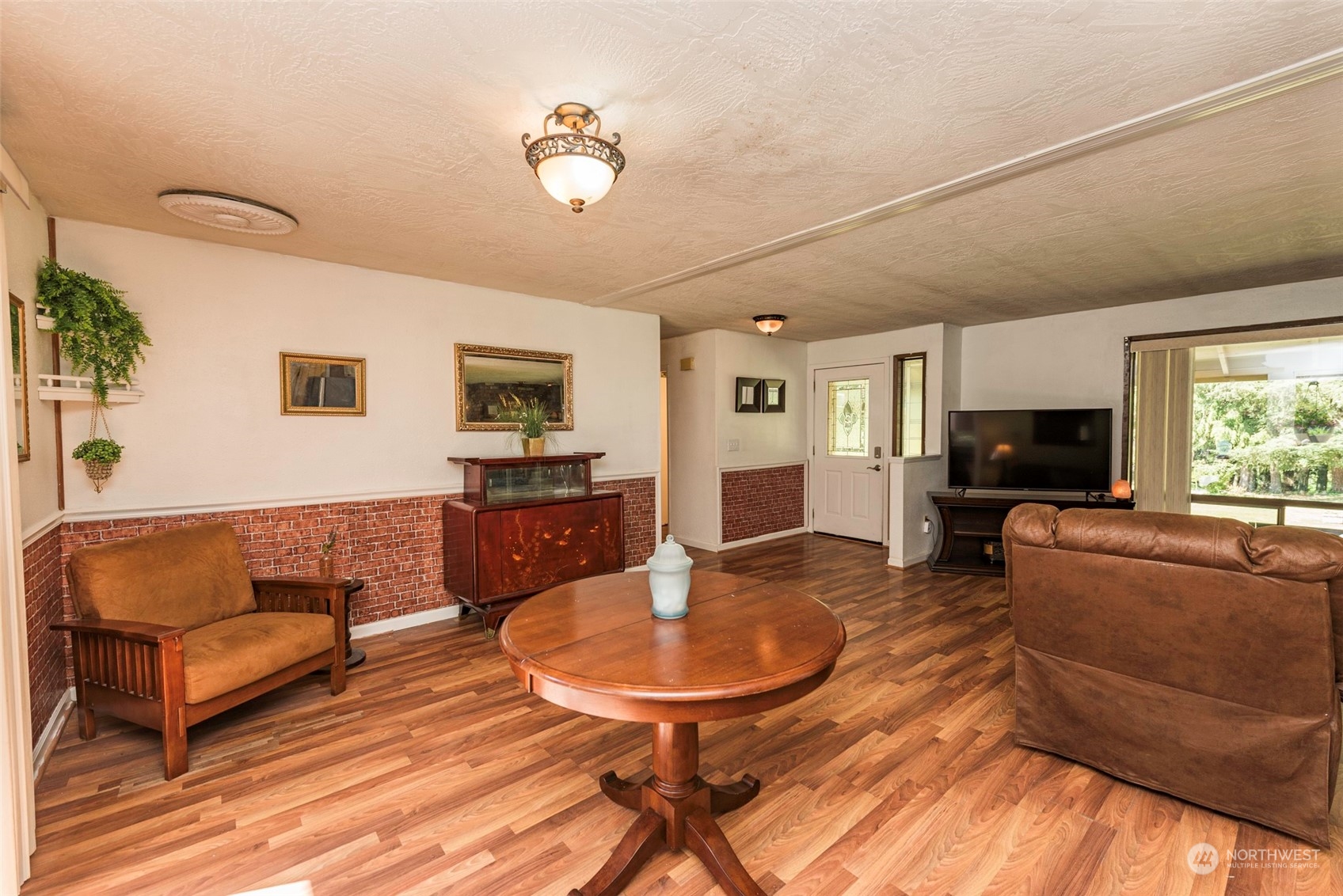 306 Webb Road Sequim, WA 98382 - Photo 9 of 40 a living room with furniture and a flat screen tv