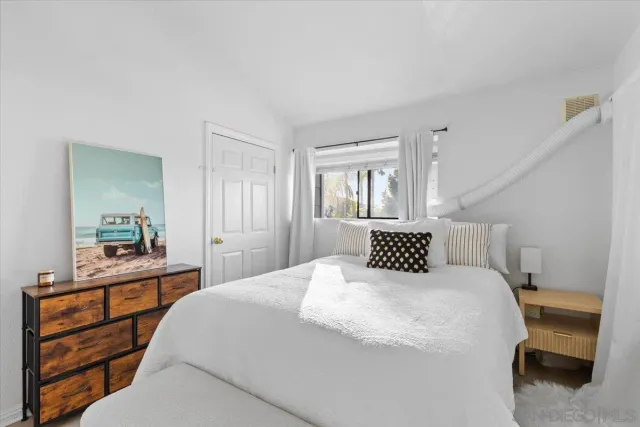 a bedroom with a bed and a cabinets