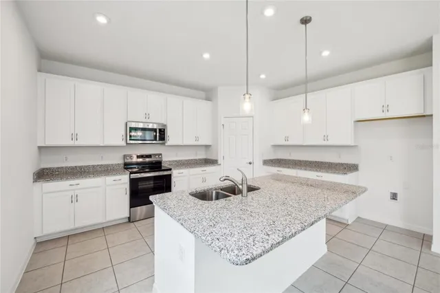 $390,560 | 12983 Trovita Drive, Grand Island, FL 32735