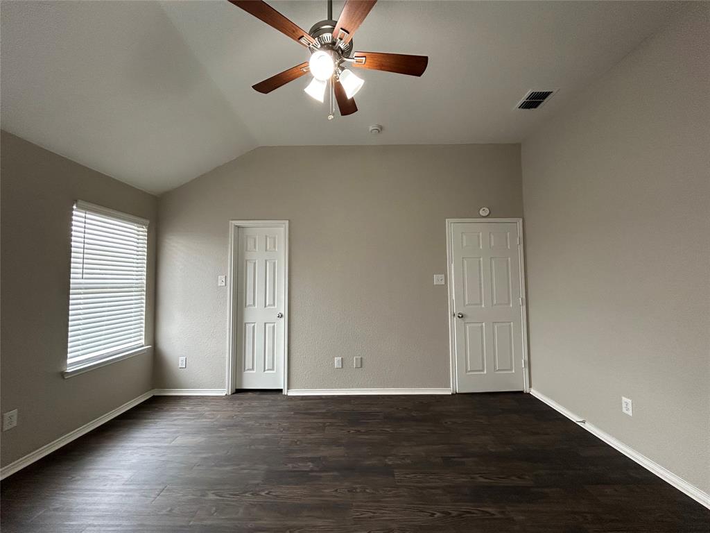 1249 Round Pen Run Fort Worth, TX 76052 - Photo 11 of 28 a view of an empty room with a window and wooden floor