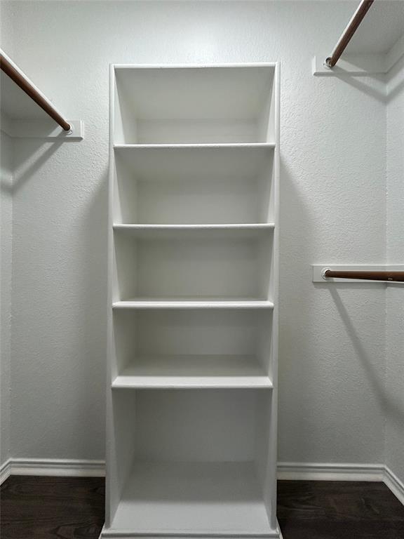 1249 Round Pen Run Fort Worth, TX 76052 - Photo 23 of 28 a view of walk in closet with empty racks