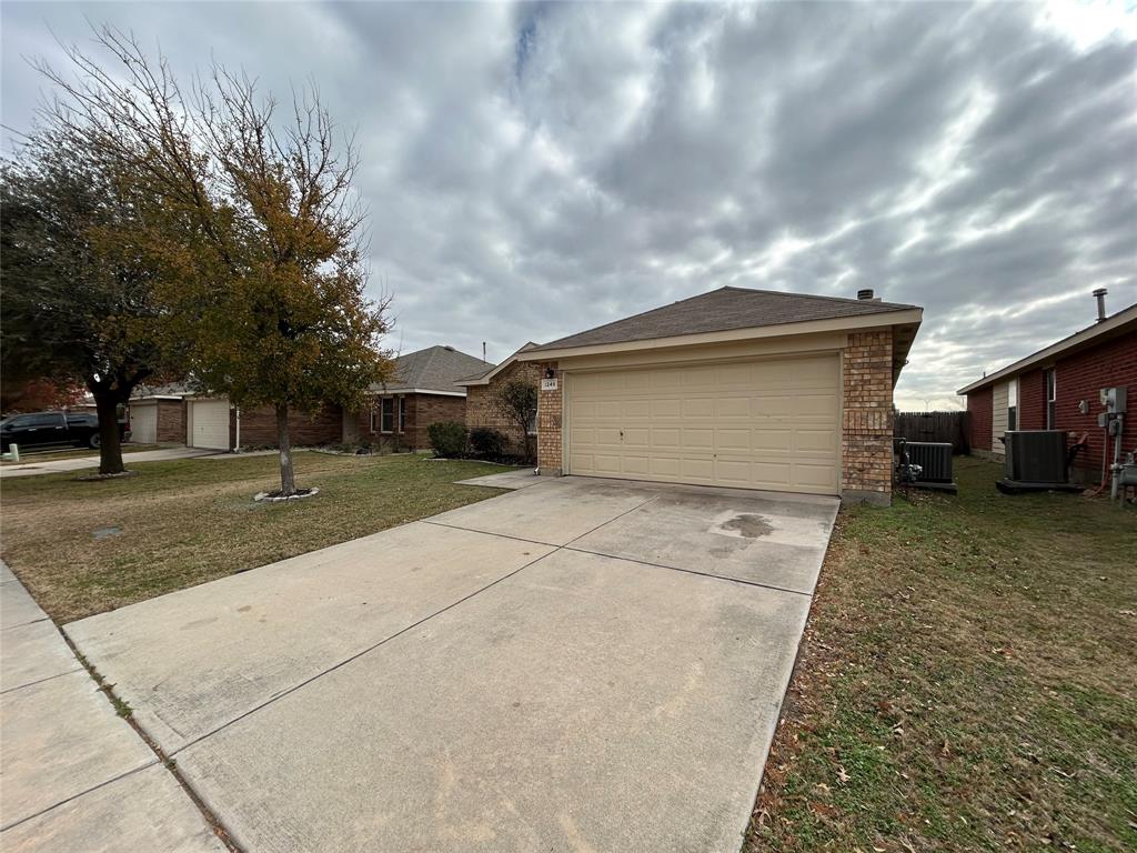 1249 Round Pen Run Fort Worth, TX 76052 - Photo 27 of 28 a front view of a house with a yard