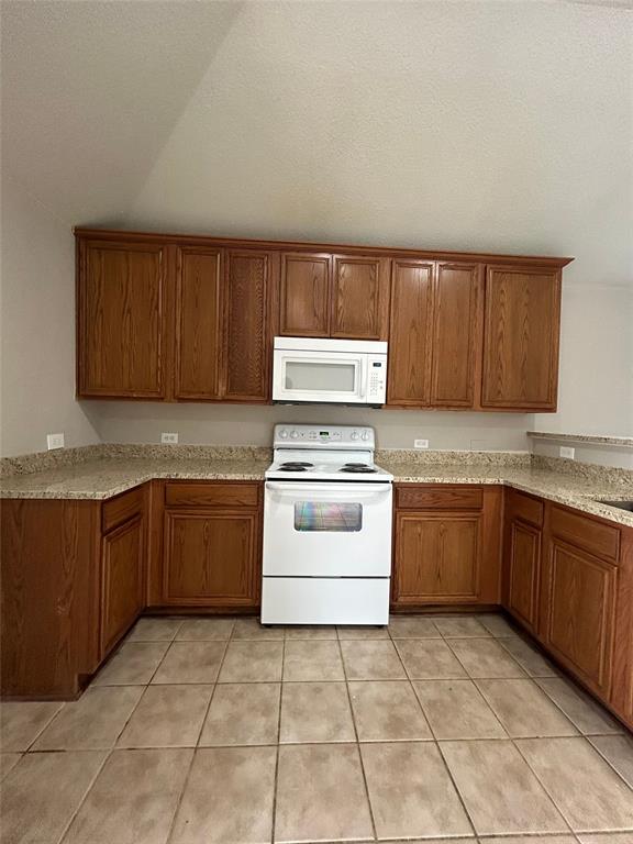 1249 Round Pen Run Fort Worth, TX 76052 - Photo 4 of 28 a kitchen with a stove top oven sink and cabinets