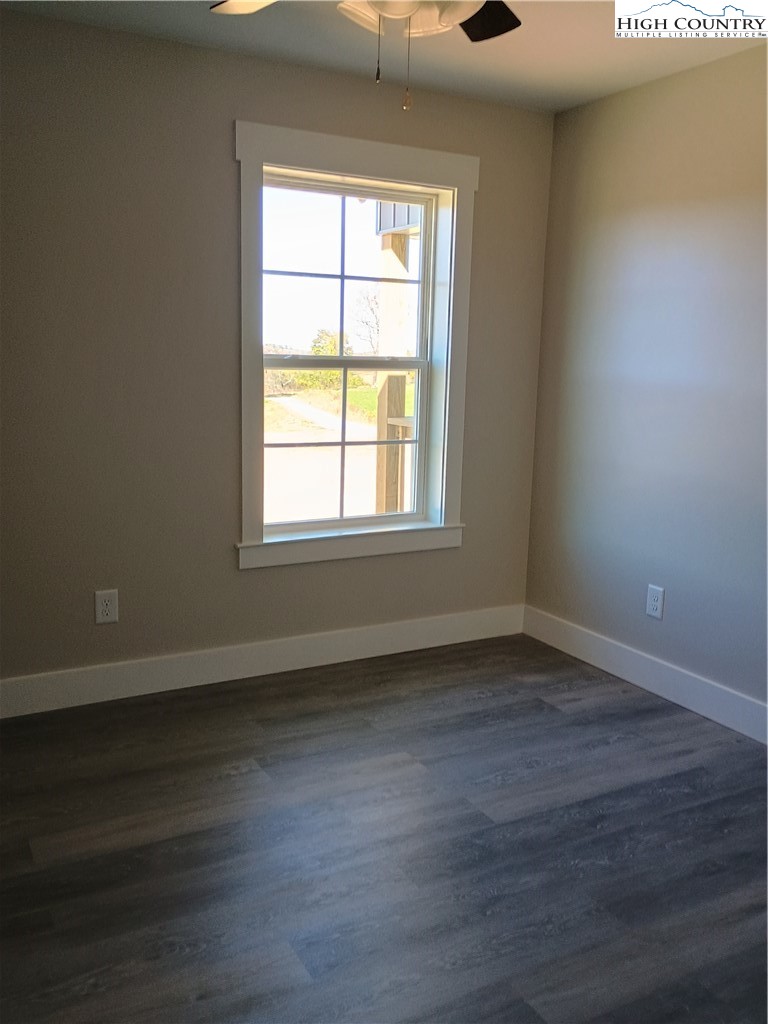 50 Millards Way Sparta, NC 28675 - Photo 7 of 11 a view of an empty room with wooden floor and a window