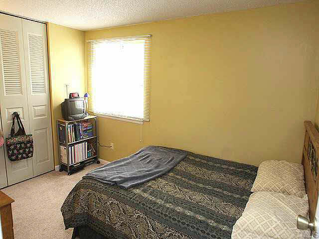 7707 Kingsberry Court Raleigh, NC 27615 - Photo 5 of 9 a bedroom with a bed dresser and a window