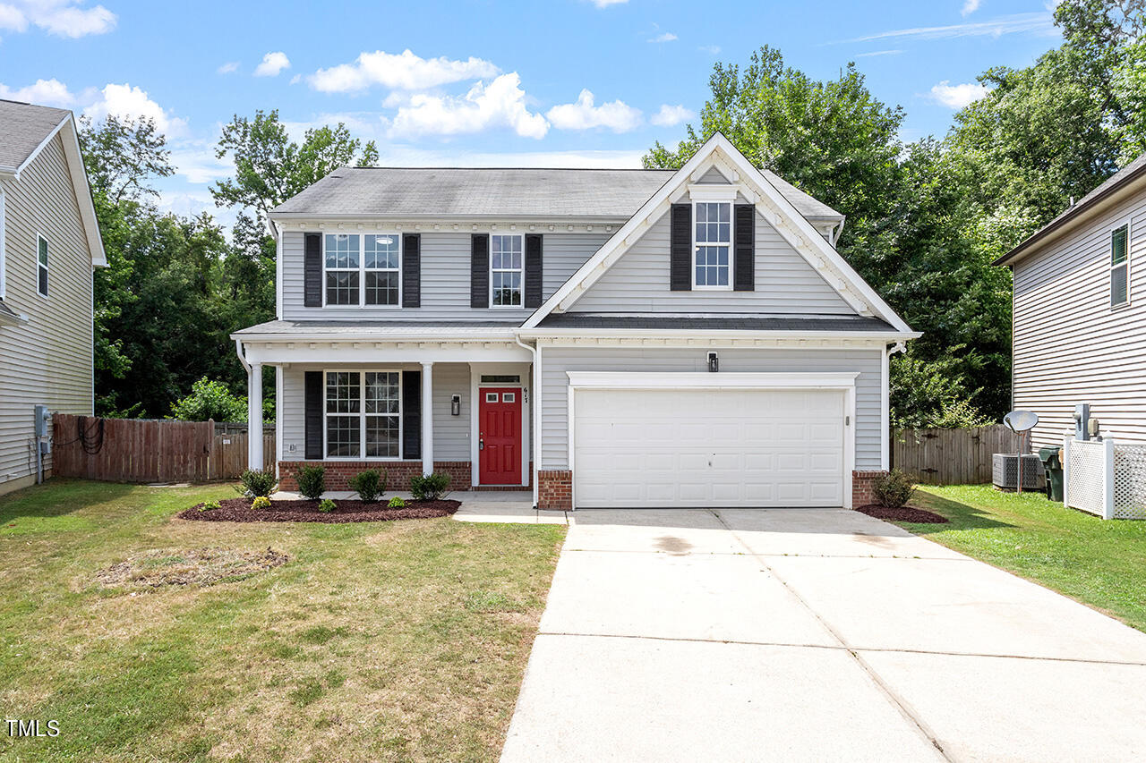 617 McCarthy Drive Clayton, NC 27527 - Photo 1 of 44 a front view of a house with a yard