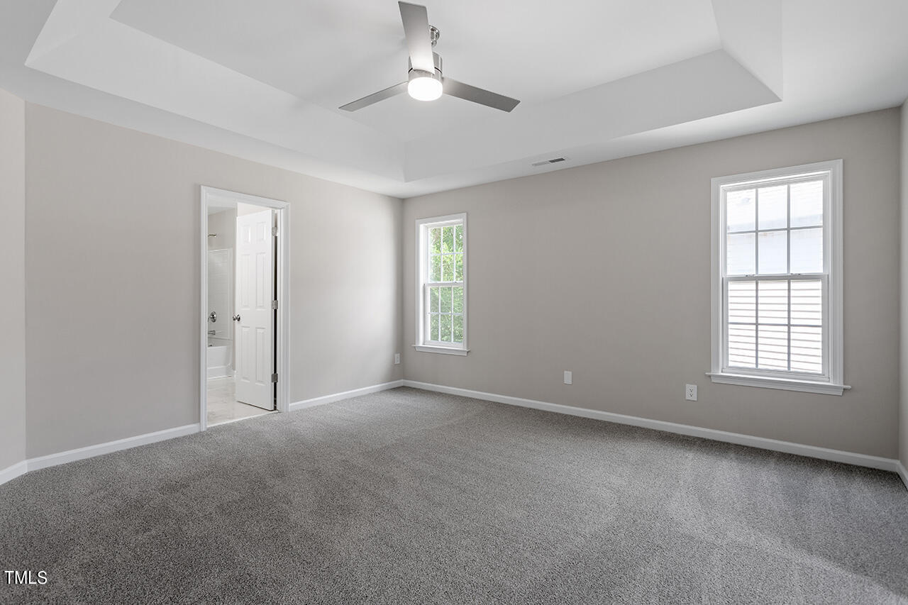 617 McCarthy Drive Clayton, NC 27527 - Photo 16 of 44 a view of an empty room with a window