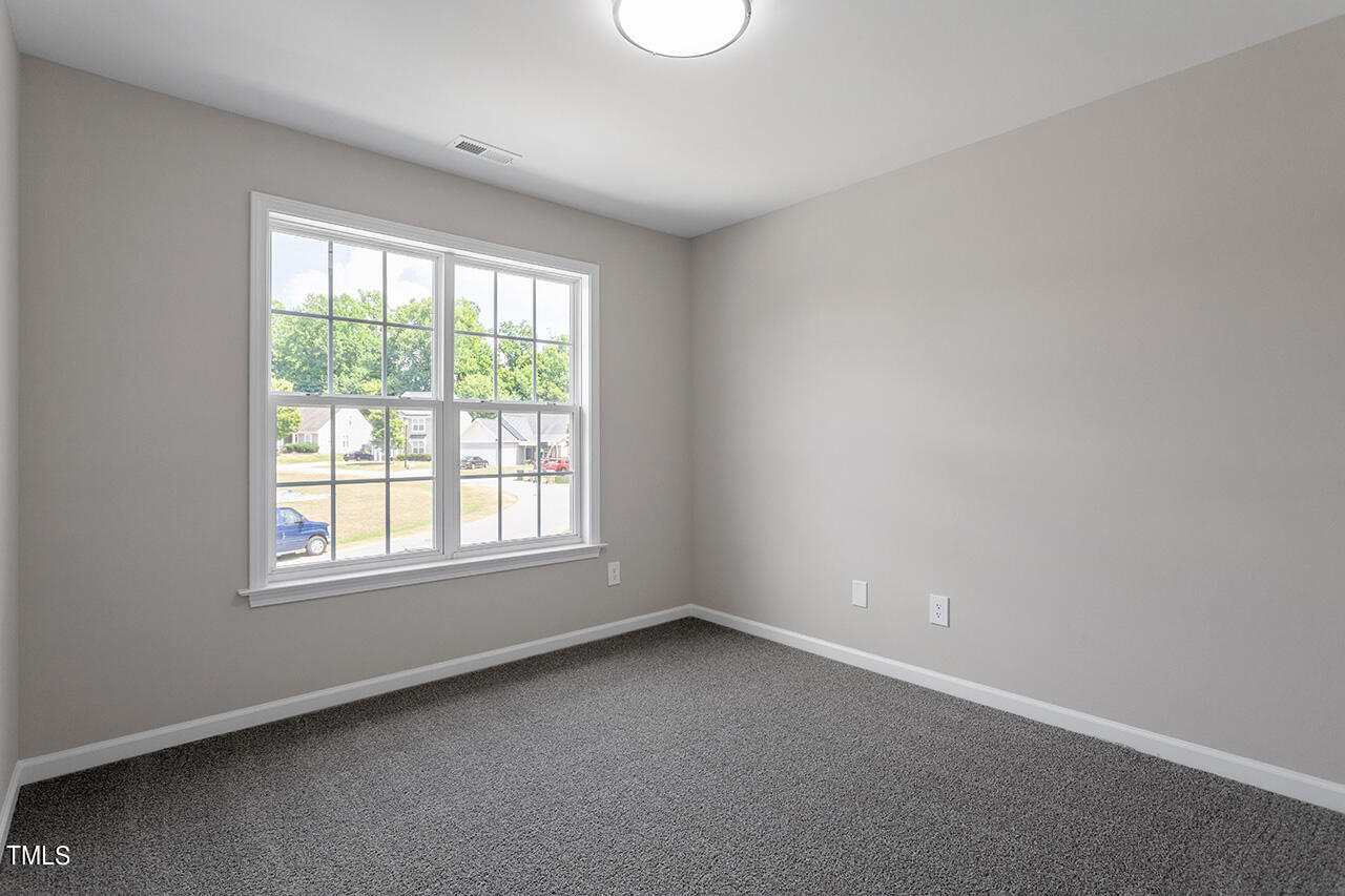617 McCarthy Drive Clayton, NC 27527 - Photo 18 of 44 an empty room with a window
