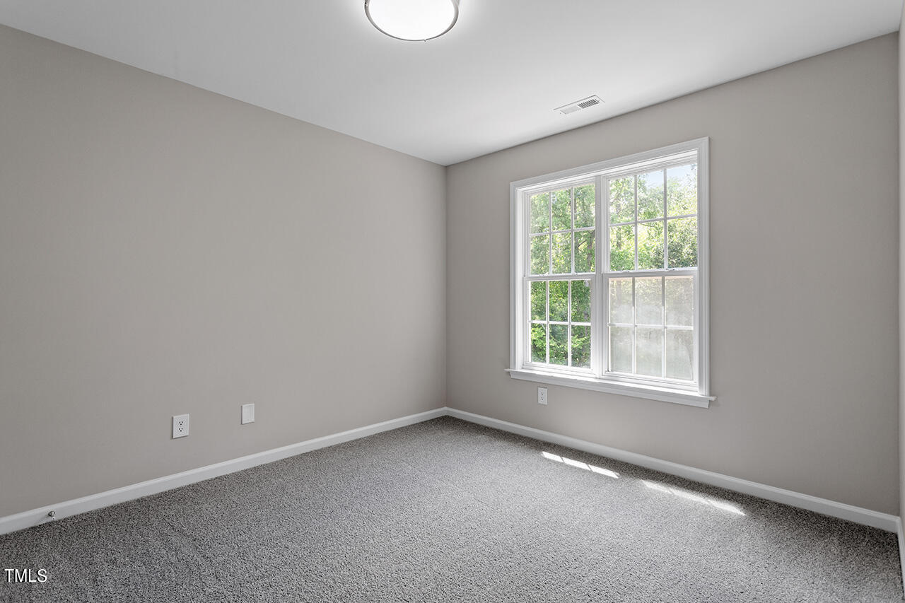617 McCarthy Drive Clayton, NC 27527 - Photo 19 of 44 an empty room with a window