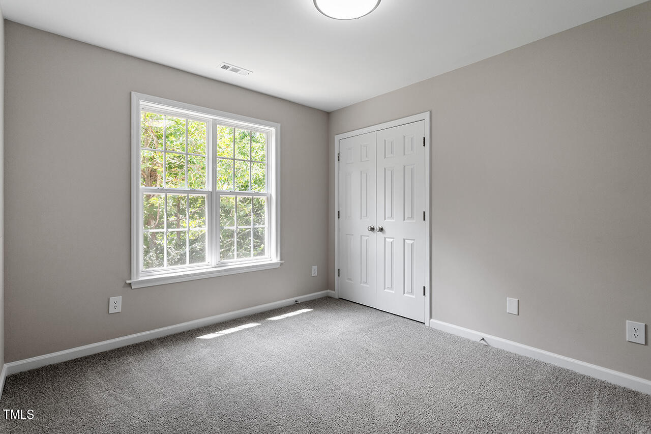 617 McCarthy Drive Clayton, NC 27527 - Photo 20 of 44 an empty room with a window