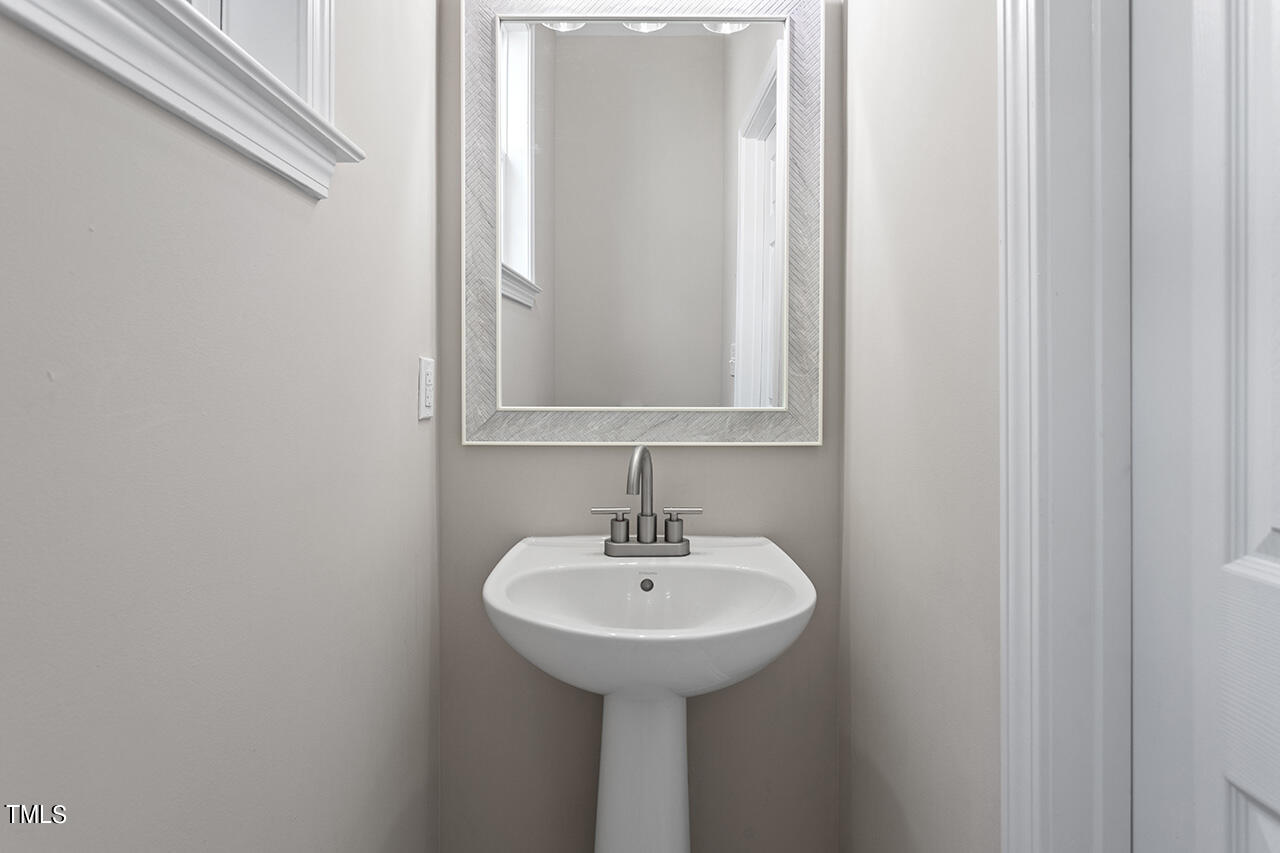 617 McCarthy Drive Clayton, NC 27527 - Photo 21 of 44 a bathroom with a sink and a mirror