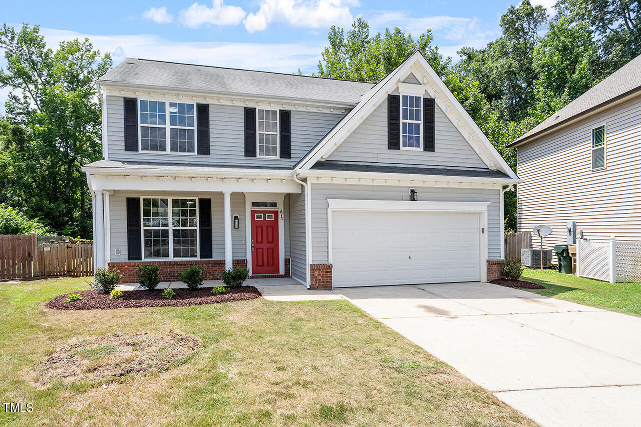 617 McCarthy Drive Clayton, NC 27527 - Photo 26 of 44 a front view of a house with a yard