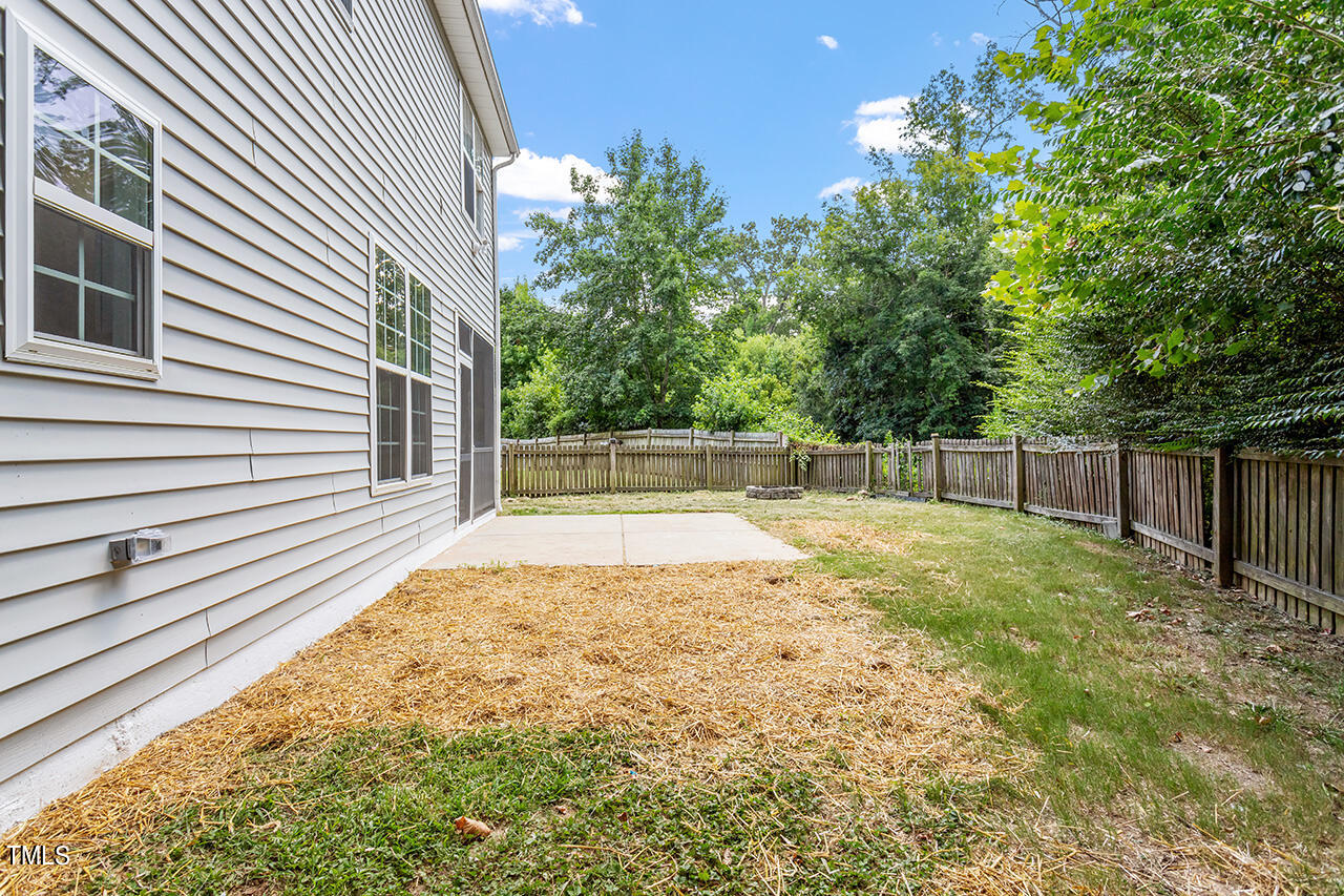 617 McCarthy Drive Clayton, NC 27527 - Photo 31 of 44 a view of backyard with wooden fence