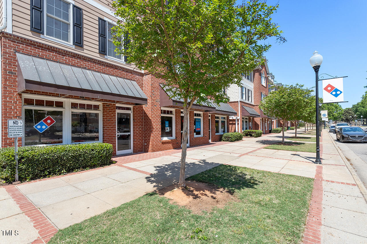 617 McCarthy Drive Clayton, NC 27527 - Photo 38 of 44 a front view of a house with a yard and garage