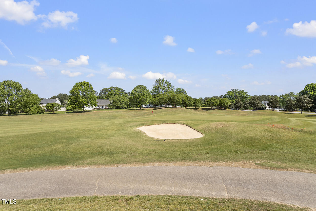 617 McCarthy Drive Clayton, NC 27527 - Photo 41 of 44 a view of a lake and a yard