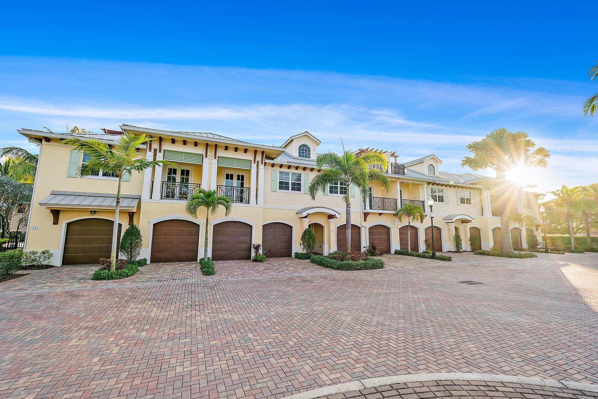 3770 County Line Road, Unit C2 Tequesta, FL 33469 - Photo 5 of 27 a view of a white building with a yard