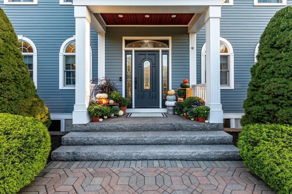 9 Anna Drive Danvers, MA 01923 - Photo 2 of 3 a view of a house with potted plants