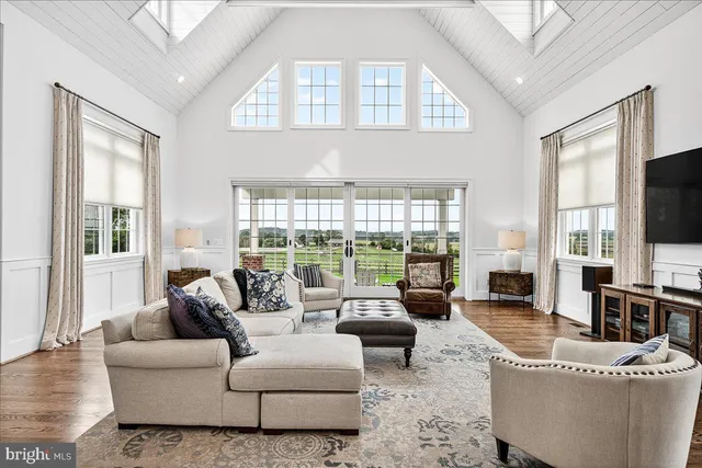 a spacious bedroom with a bed and a fireplace