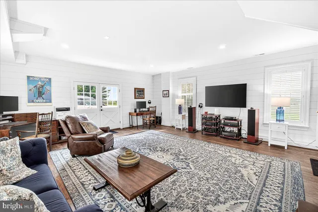 a bathroom with a sink mirror and toilet