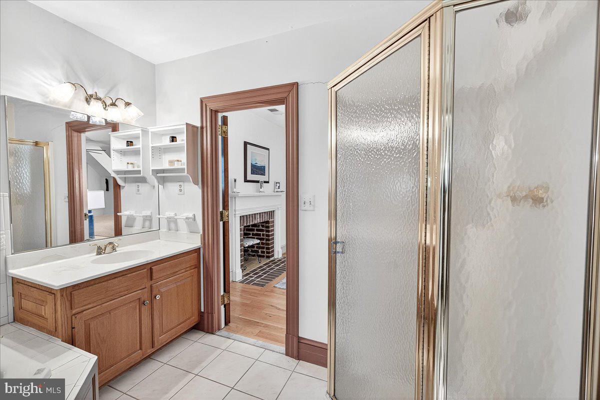 9522 Bessie Clemson Road Union Bridge, MD 21791 - Photo 47 of 107 a bathroom with a double vanity sink a mirror and a shower