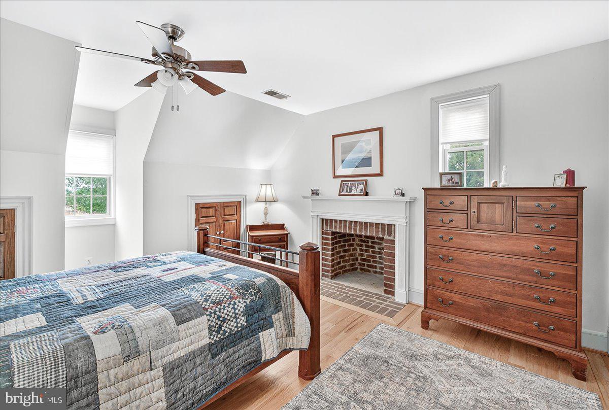 9522 Bessie Clemson Road Union Bridge, MD 21791 - Photo 51 of 107 a bedroom with a bed a dresser and a window