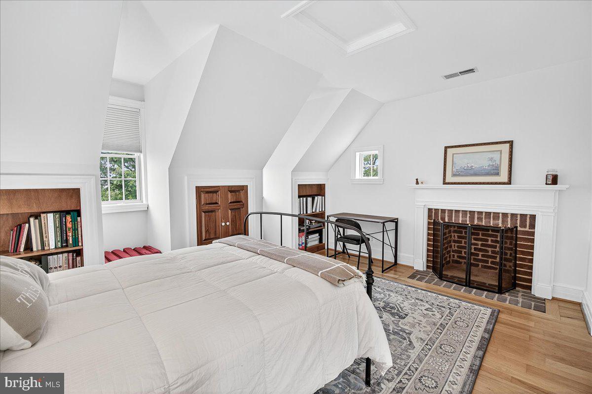 9522 Bessie Clemson Road Union Bridge, MD 21791 - Photo 54 of 107 a bedroom with a bed a dresser and a book shelf