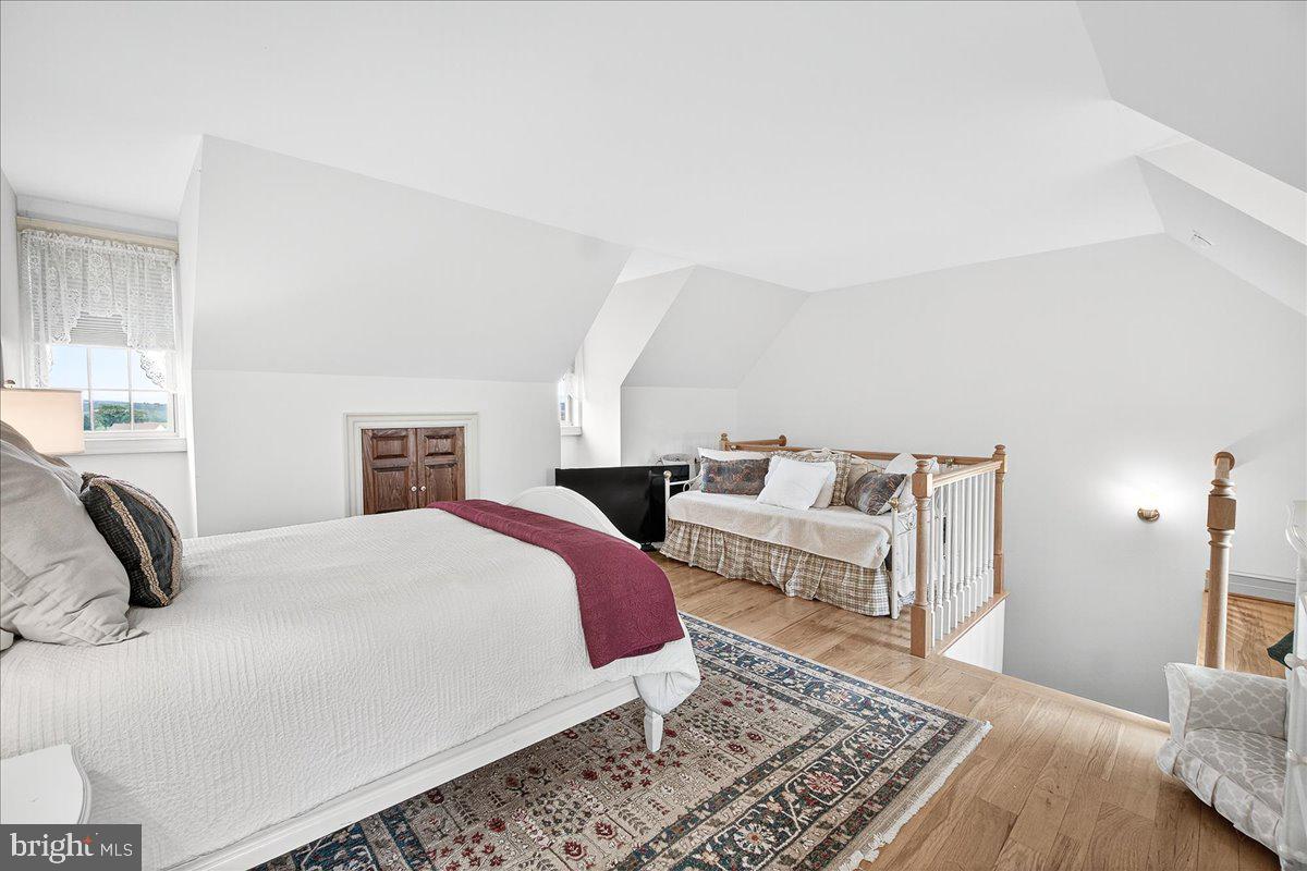 9522 Bessie Clemson Road Union Bridge, MD 21791 - Photo 57 of 107 a bedroom with a bed a couch and a dresser