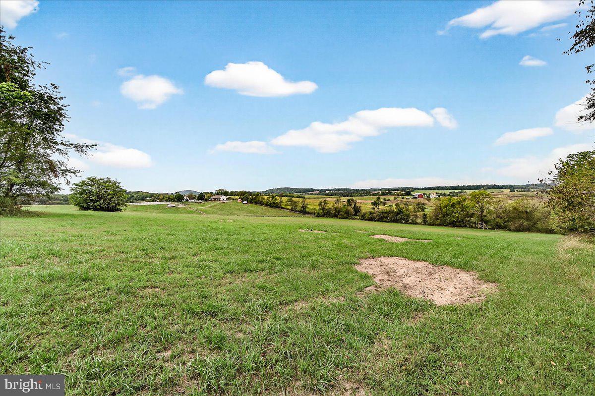 9522 Bessie Clemson Road Union Bridge, MD 21791 - Photo 79 of 107 a view of a golf course with a lake