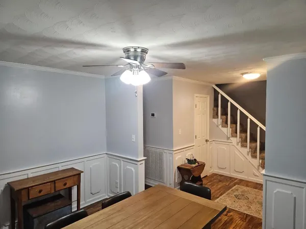 a view of living room with furniture and flat screen tv