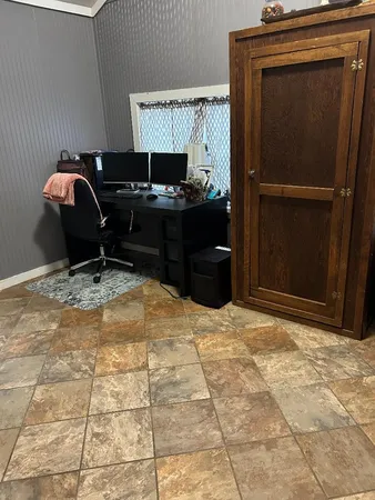 a room with furniture and a flat screen tv