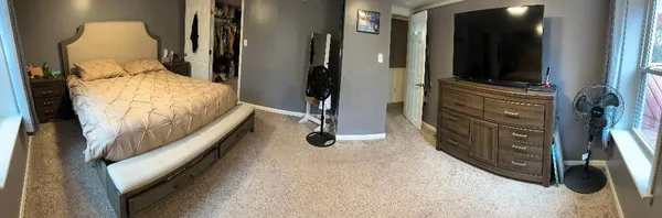 a bedroom with a bed and furniture