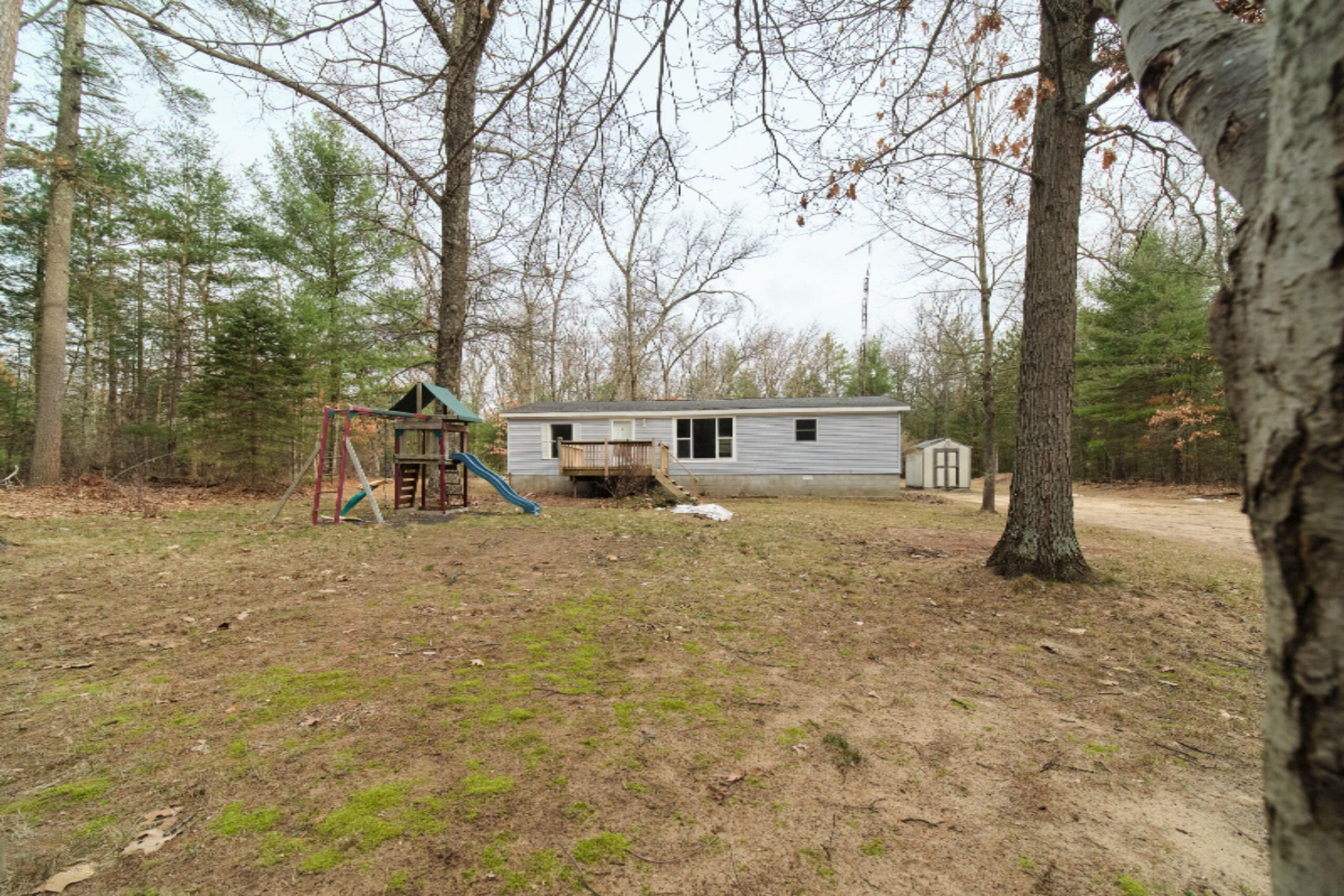 2230 Raymond Road Twin Lake, MI 49457 - Photo 2 of 47 Front of Home