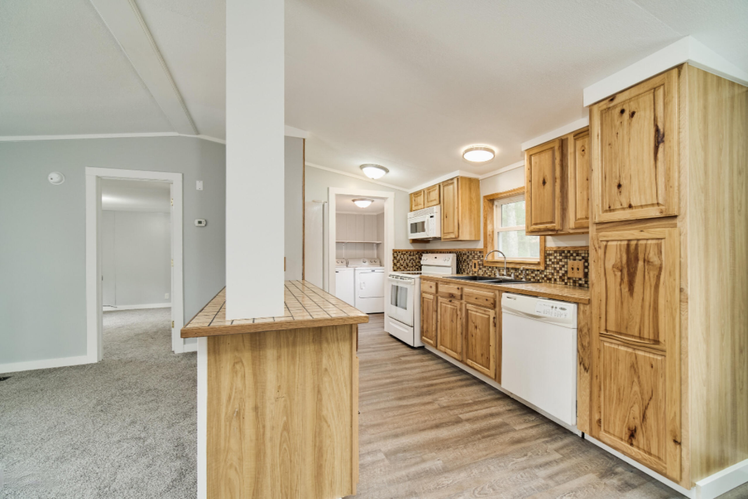 2230 Raymond Road Twin Lake, MI 49457 - Photo 21 of 47 Open Kitchen and Living Room