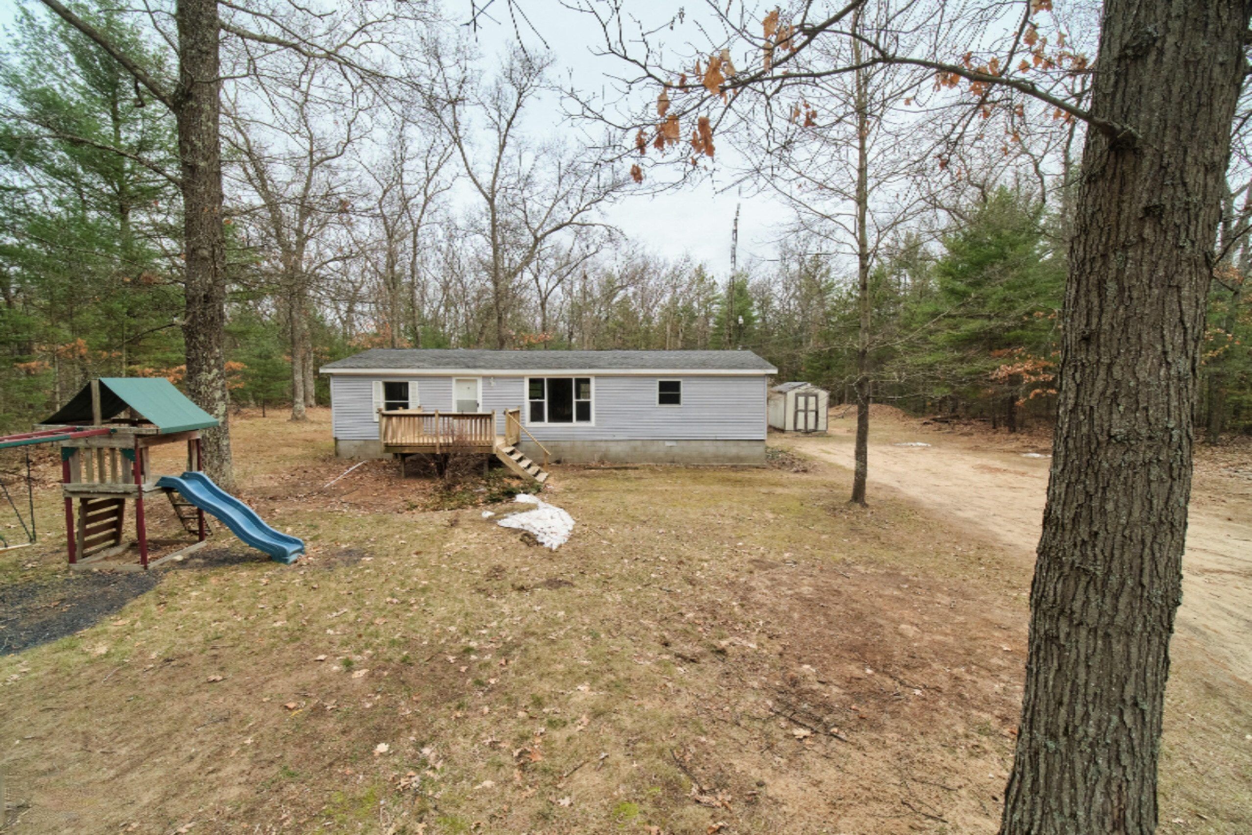 2230 Raymond Road Twin Lake, MI 49457 - Photo 3 of 47 Front of Home