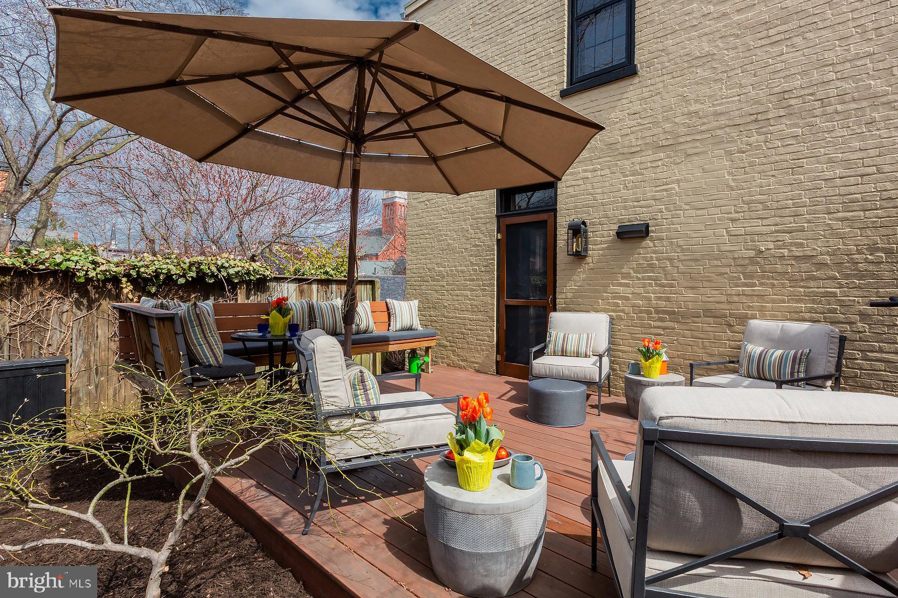 125 South Duke Street Lancaster, PA 17602 - Photo 26 of 40 a view of an outdoor sitting area with furniture and umbrella