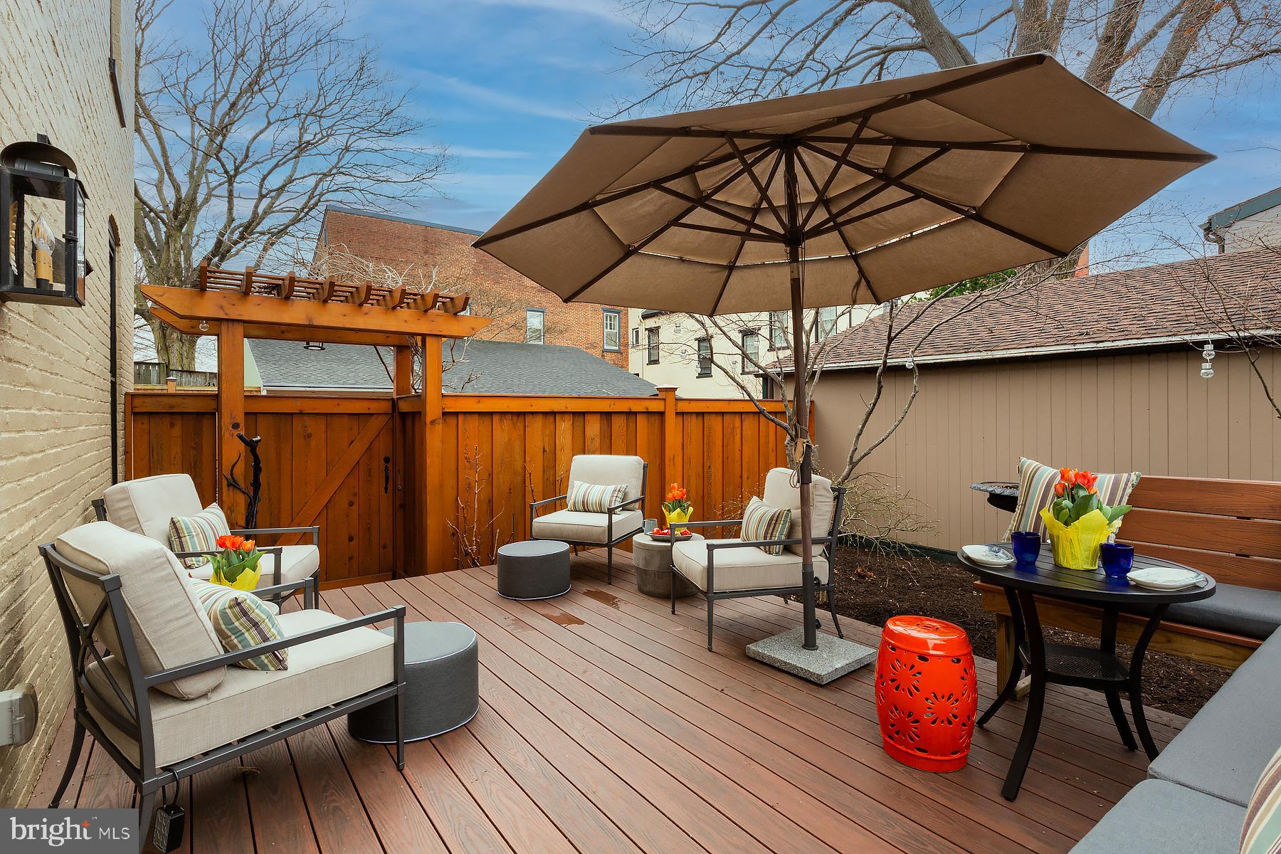 125 South Duke Street Lancaster, PA 17602 - Photo 5 of 40 an outdoor sitting area with furniture and umbrella