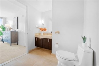 1 Franklin Street, Unit 2406 Boston, MA 02110 - Photo 7 of 22 a bathroom with a toilet and a shower
