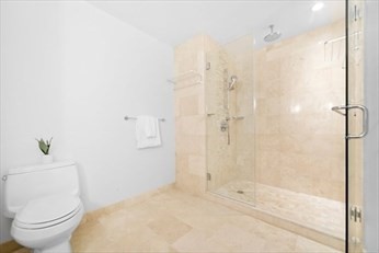 1 Franklin Street, Unit 2406 Boston, MA 02110 - Photo 8 of 22 a bathroom with a toilet and a shower