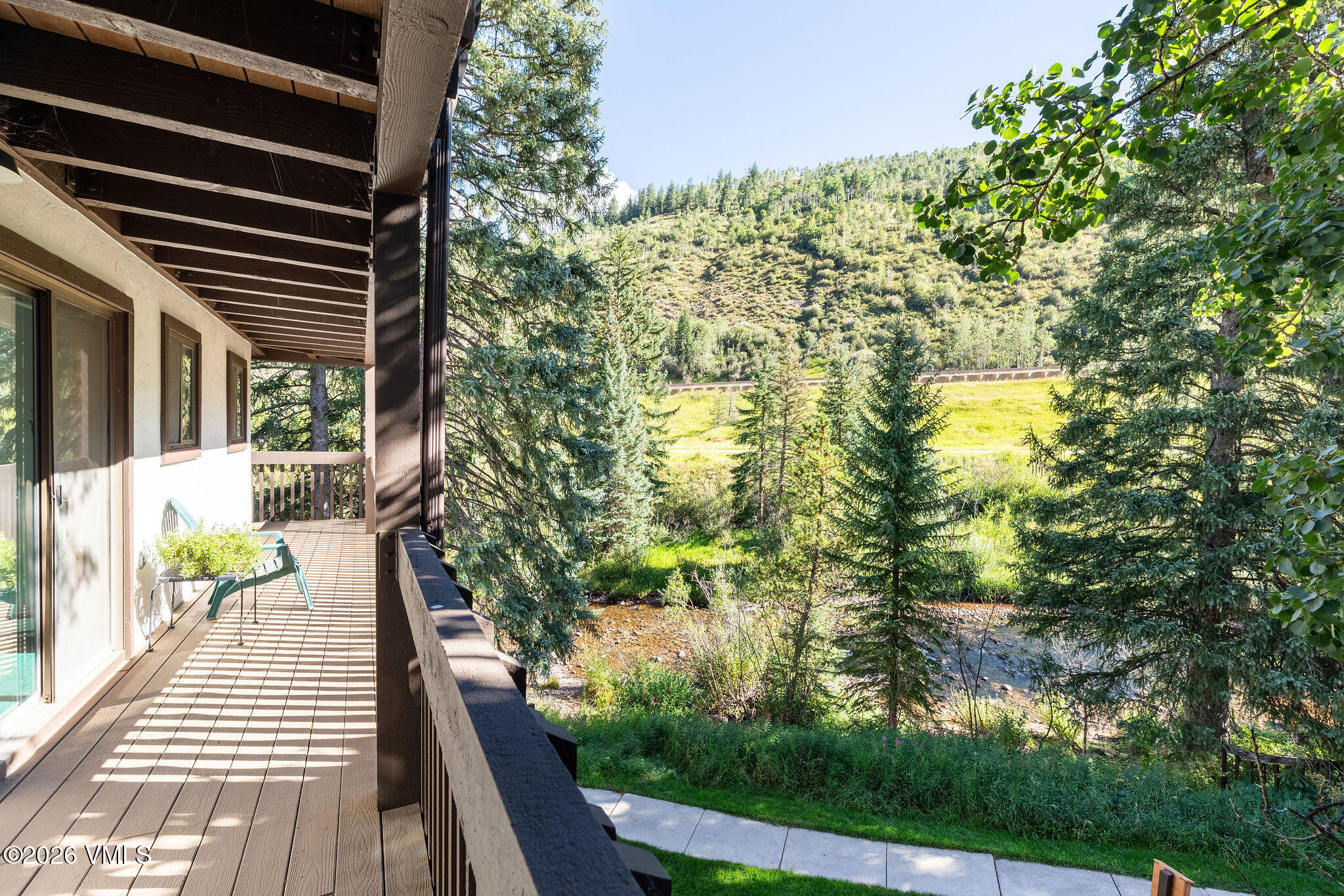 4600 Vail Racquet Club Drive, Unit 610 Vail, CO 81657 - Photo 6 of 26 a view of balcony with wooden floor and fence