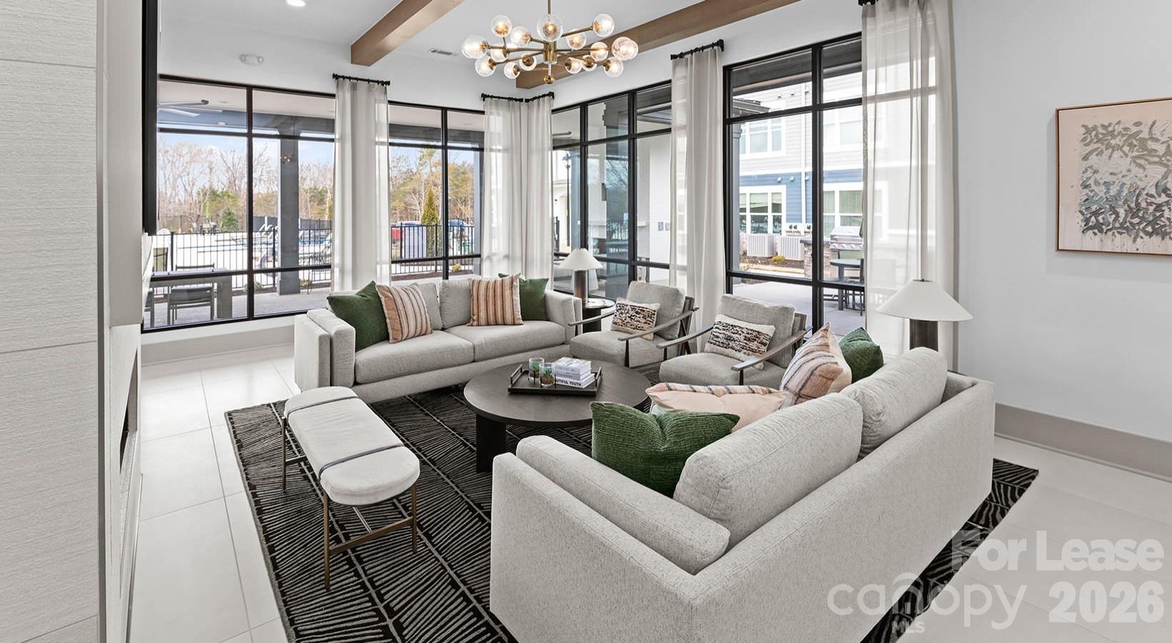2546 Perimeter Pointe Parkway, Unit 1G Charlotte, NC 28208 - Photo 12 of 48 a living room with furniture and a large window