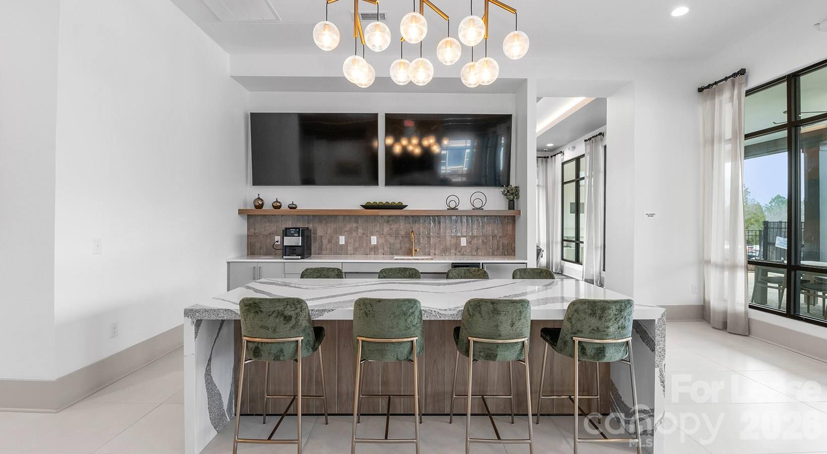 2546 Perimeter Pointe Parkway, Unit 1G Charlotte, NC 28208 - Photo 14 of 48 a kitchen with a dining table and chairs