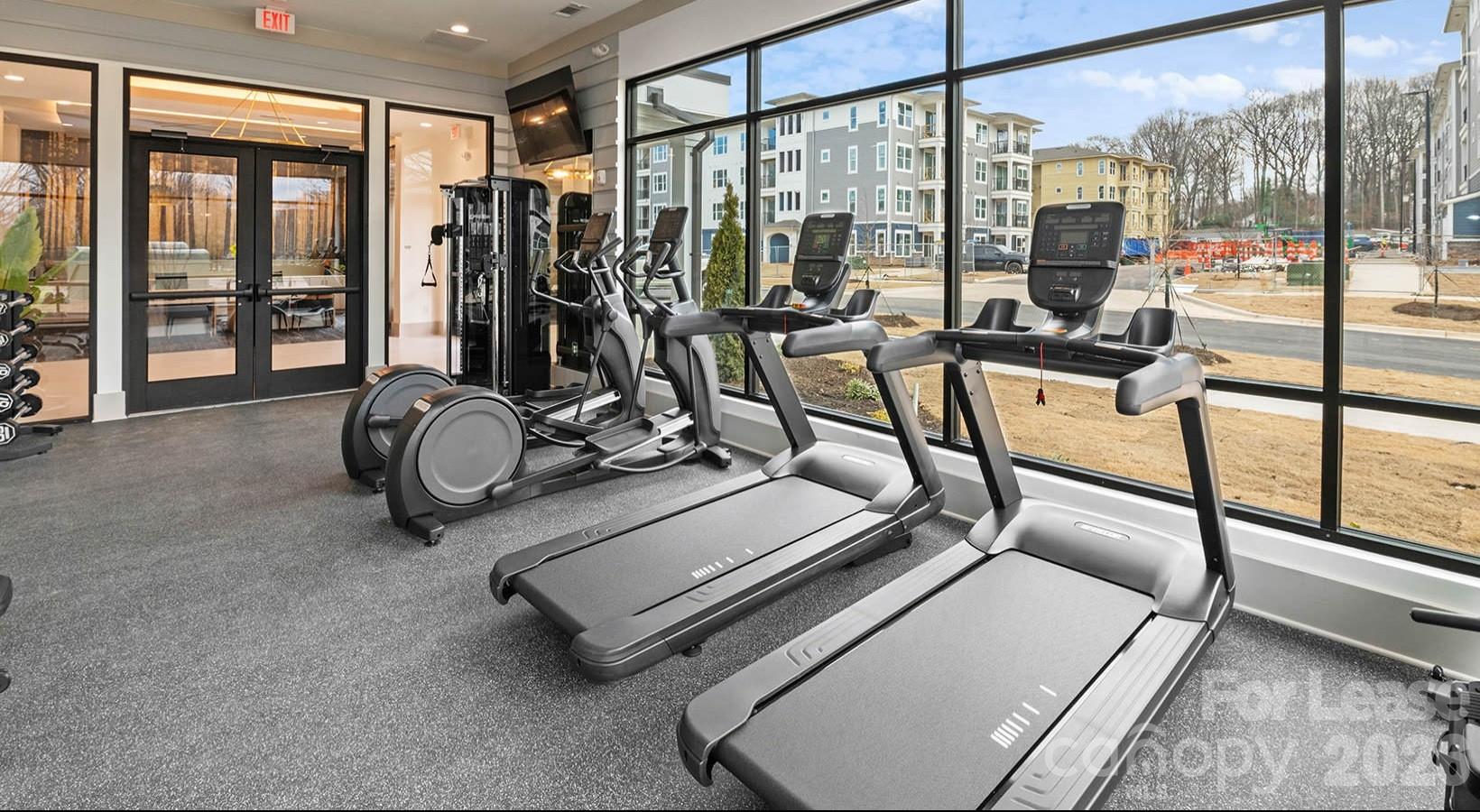 2546 Perimeter Pointe Parkway, Unit 1G Charlotte, NC 28208 - Photo 19 of 48 a view of a room with gym equipment