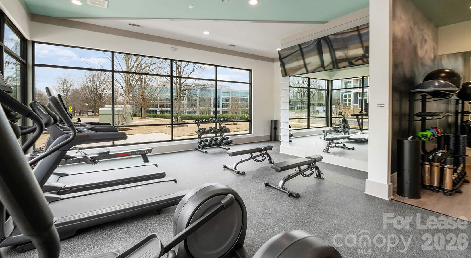 2546 Perimeter Pointe Parkway, Unit 1G Charlotte, NC 28208 - Photo 26 of 48 a view of a livingroom with couch and a large window