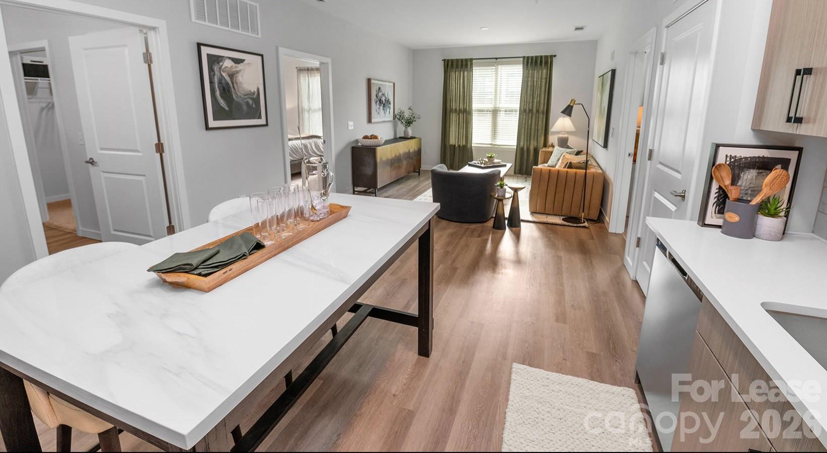 2546 Perimeter Pointe Parkway, Unit 1G Charlotte, NC 28208 - Photo 35 of 48 a room with furniture and wooden floor